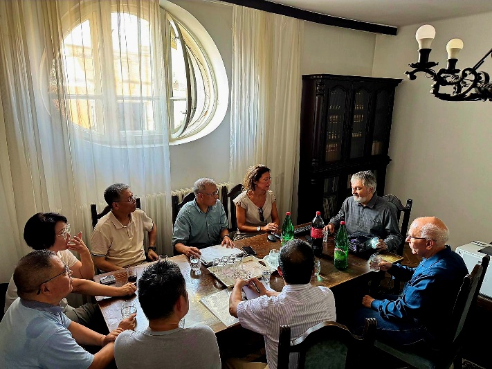 a group of people sitting around a table