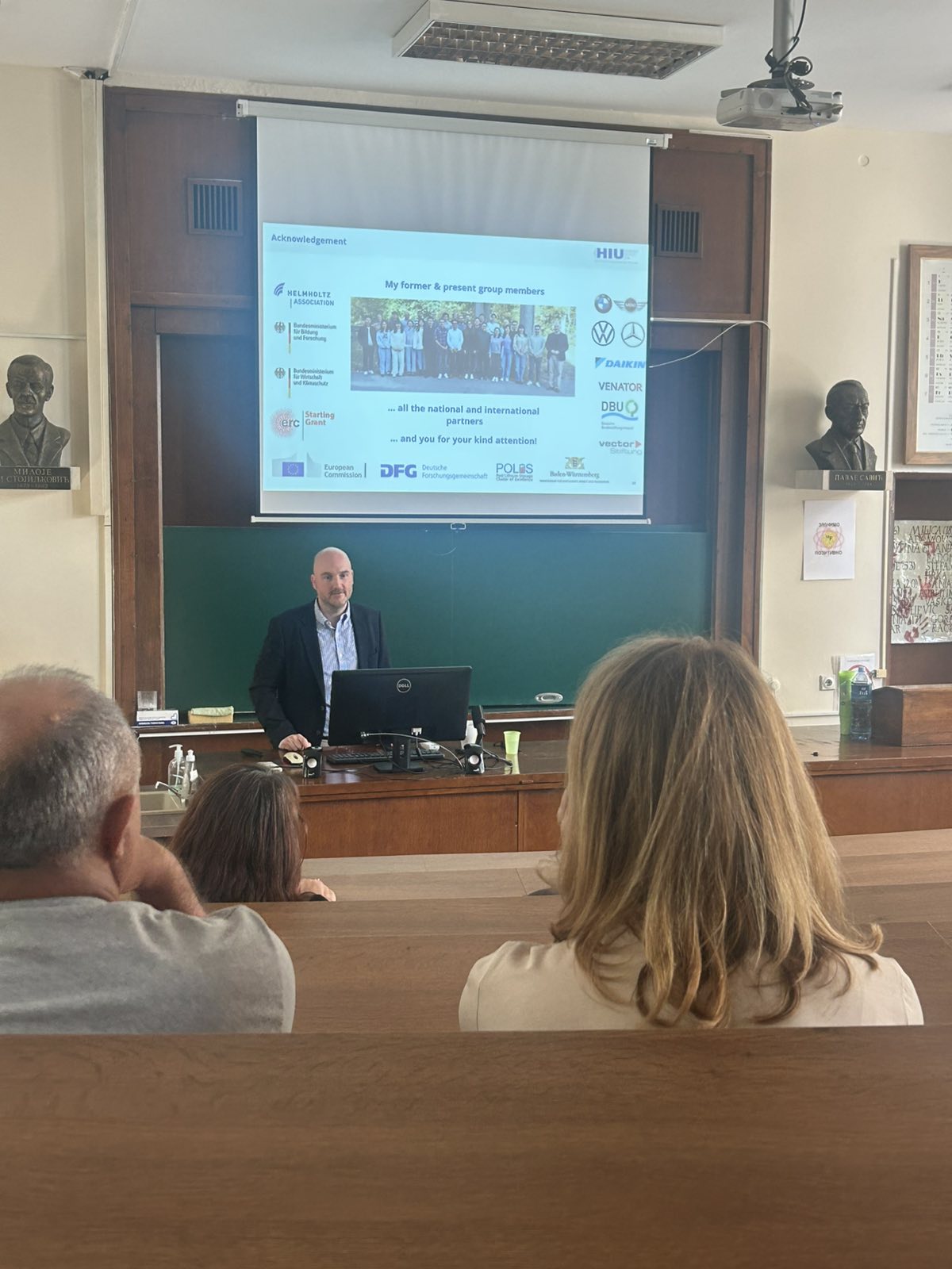 a lecturer presenting slides