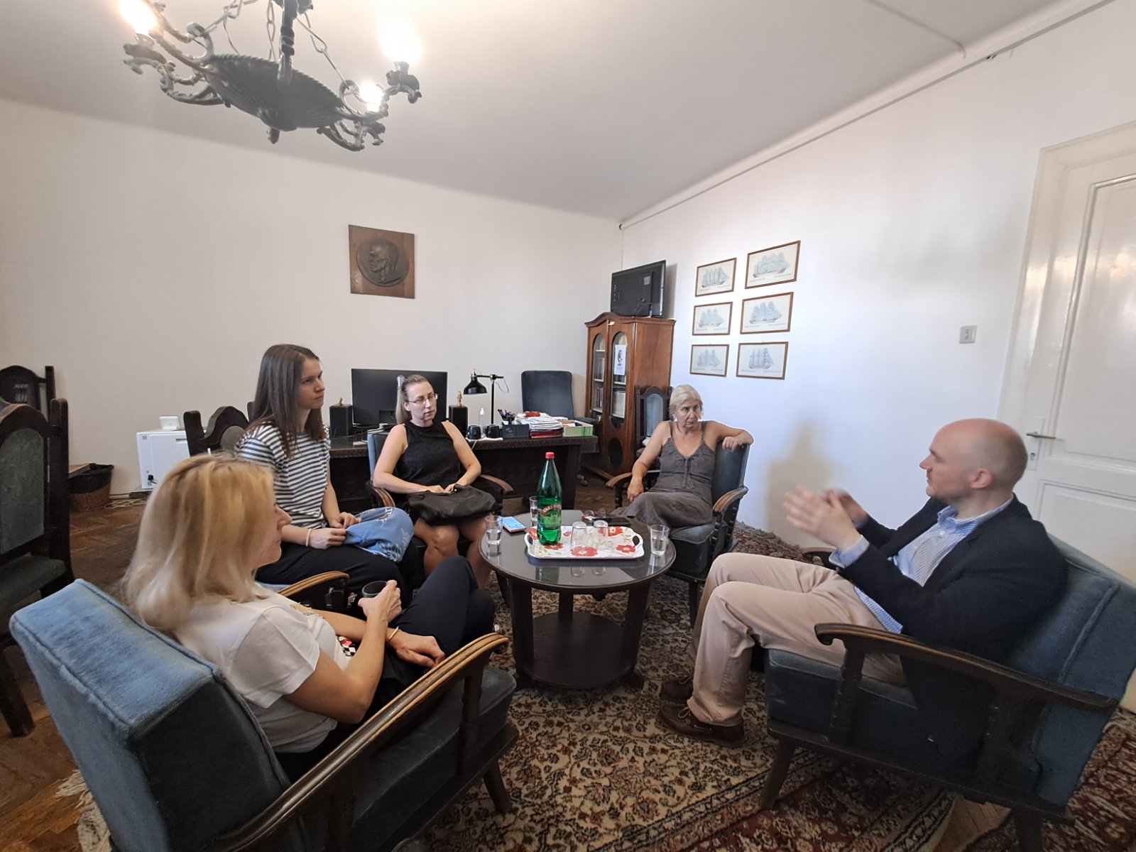 a group of people sitting around a table